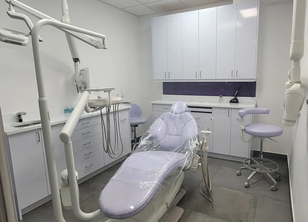 Dental operatory with A-dec chair, Tribeca Advanced Dentistry expansion built by DBF Studio